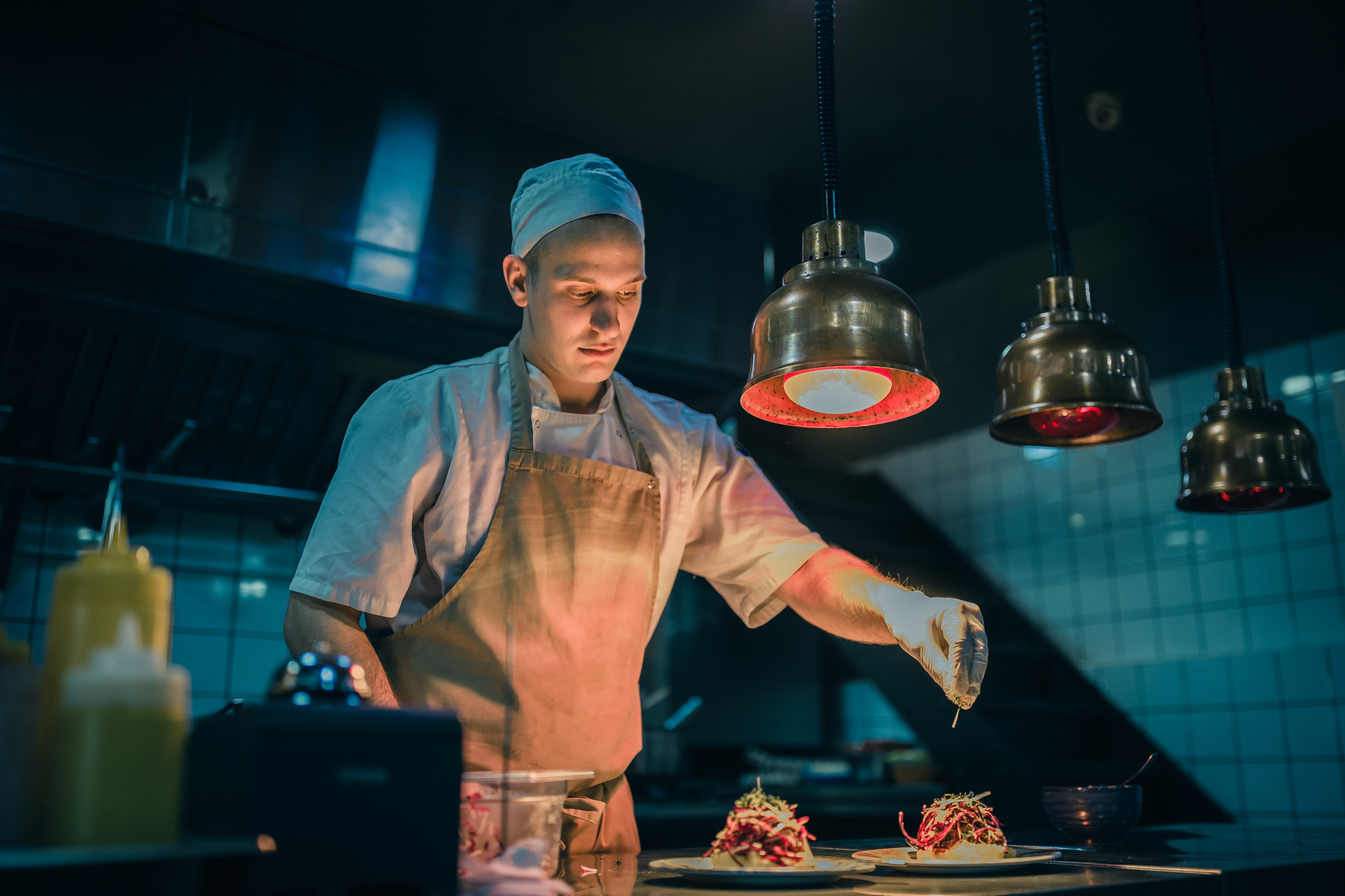 Chef cooking in the modern kitchen in a high-end restaurant