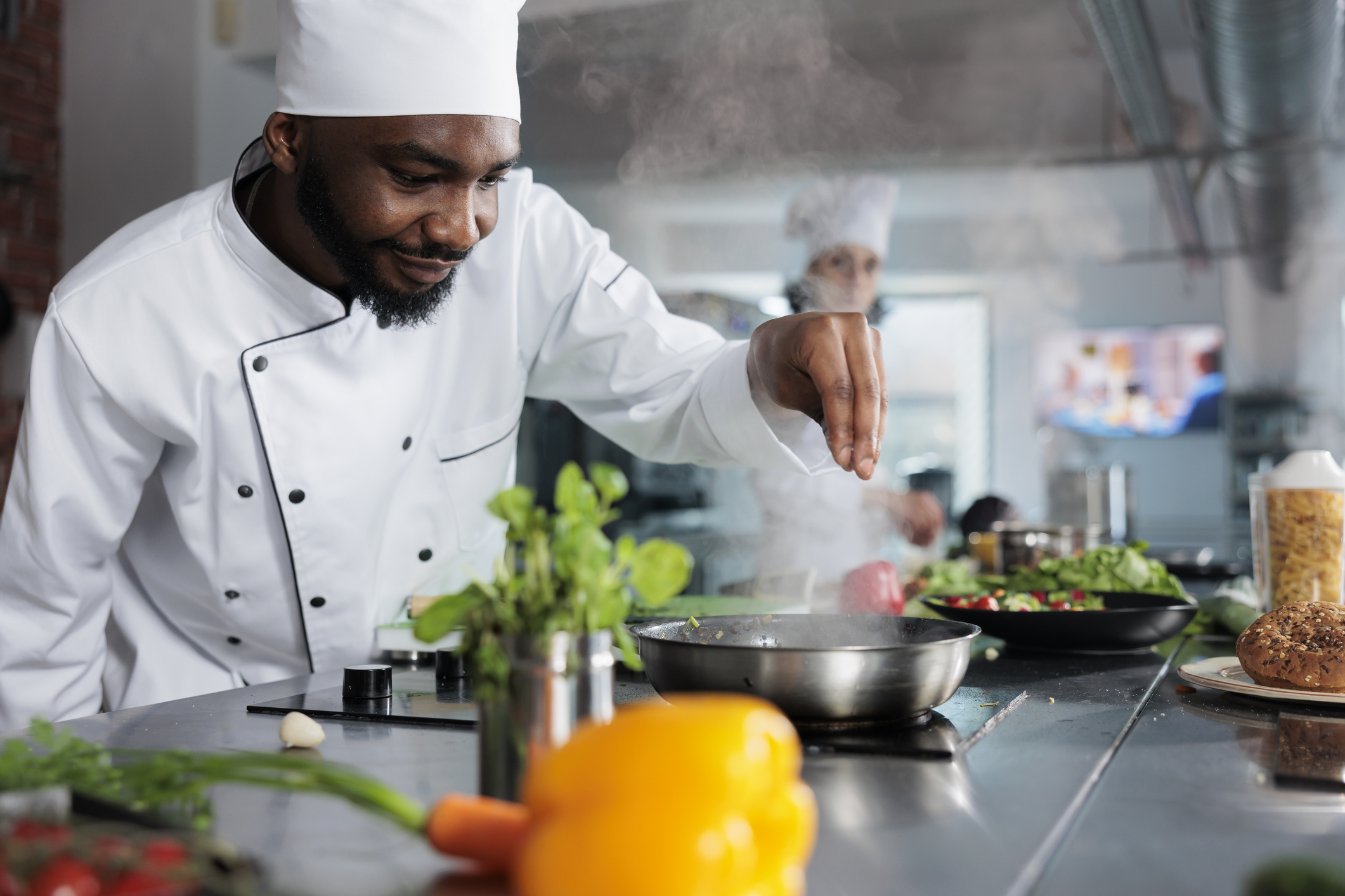 Skilled gastronomy expert garnishing gourmet dish with parmesan cheese in restaurant professional kitchen Skilled gastronomy expert garnishing gourmet dish with parmesan cheese in restaurant professional kitchen
